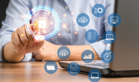 Image of a person sitting at a desk in front of a laptop with images of a lock, wifi, folders