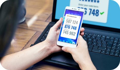 Image of someone holding a cellphone using 2FA