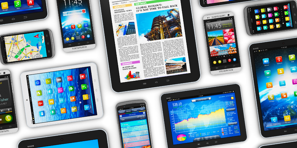 Multiple mobile devices sitting on a white table