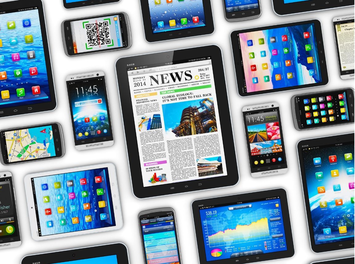 Multiple mobile devices sitting on a white table