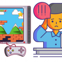 Man with head in hands at a desk in front of laptop with a video game image next to him